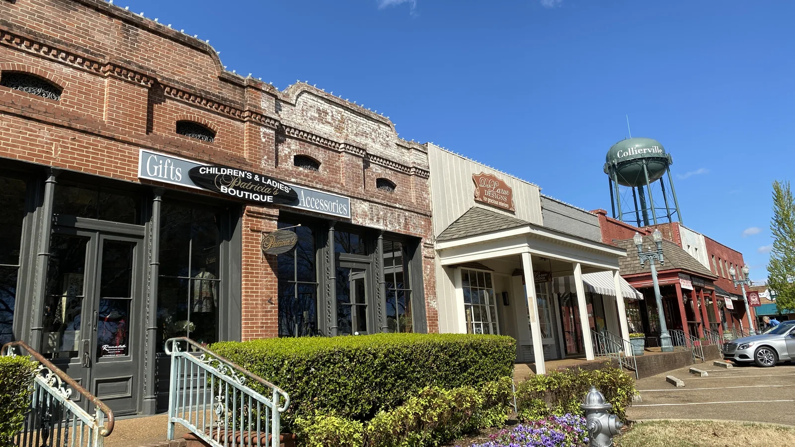Shops on the Collierville Town Square, with the town water tower behind.