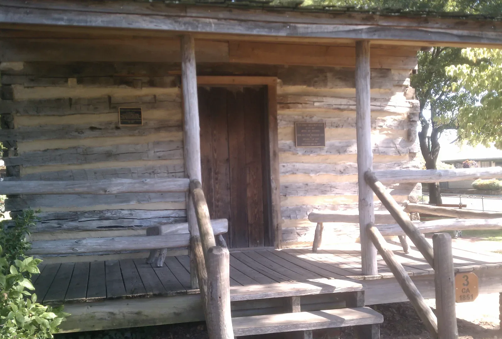 The log cabin, dated about 1851, in Town Square Park on the Collierville Town Square, where Fair on the Square is held.