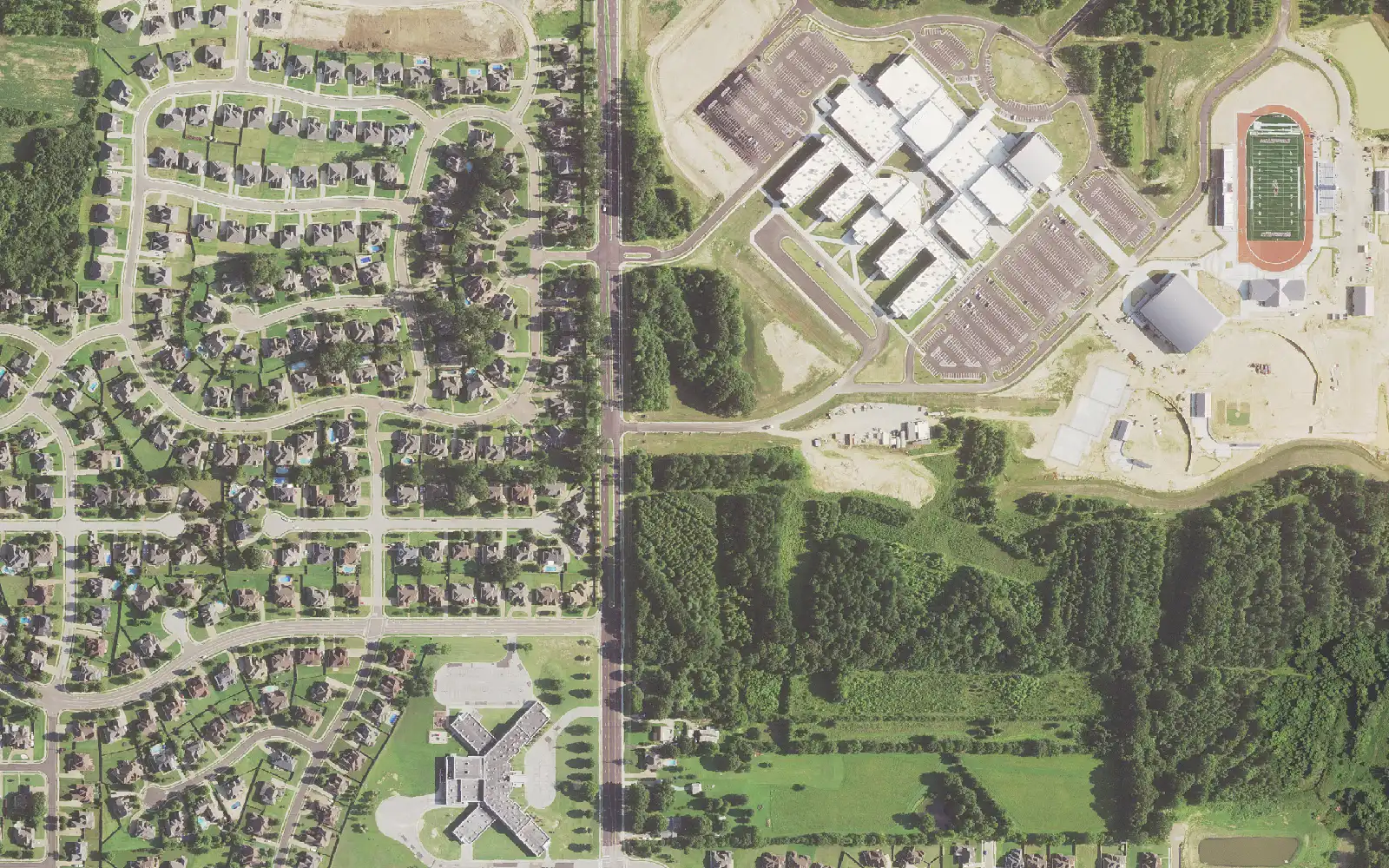 Collierville High School and its stadium, with Sycamore Elementary School at lower left, seen from the air in Collierville.