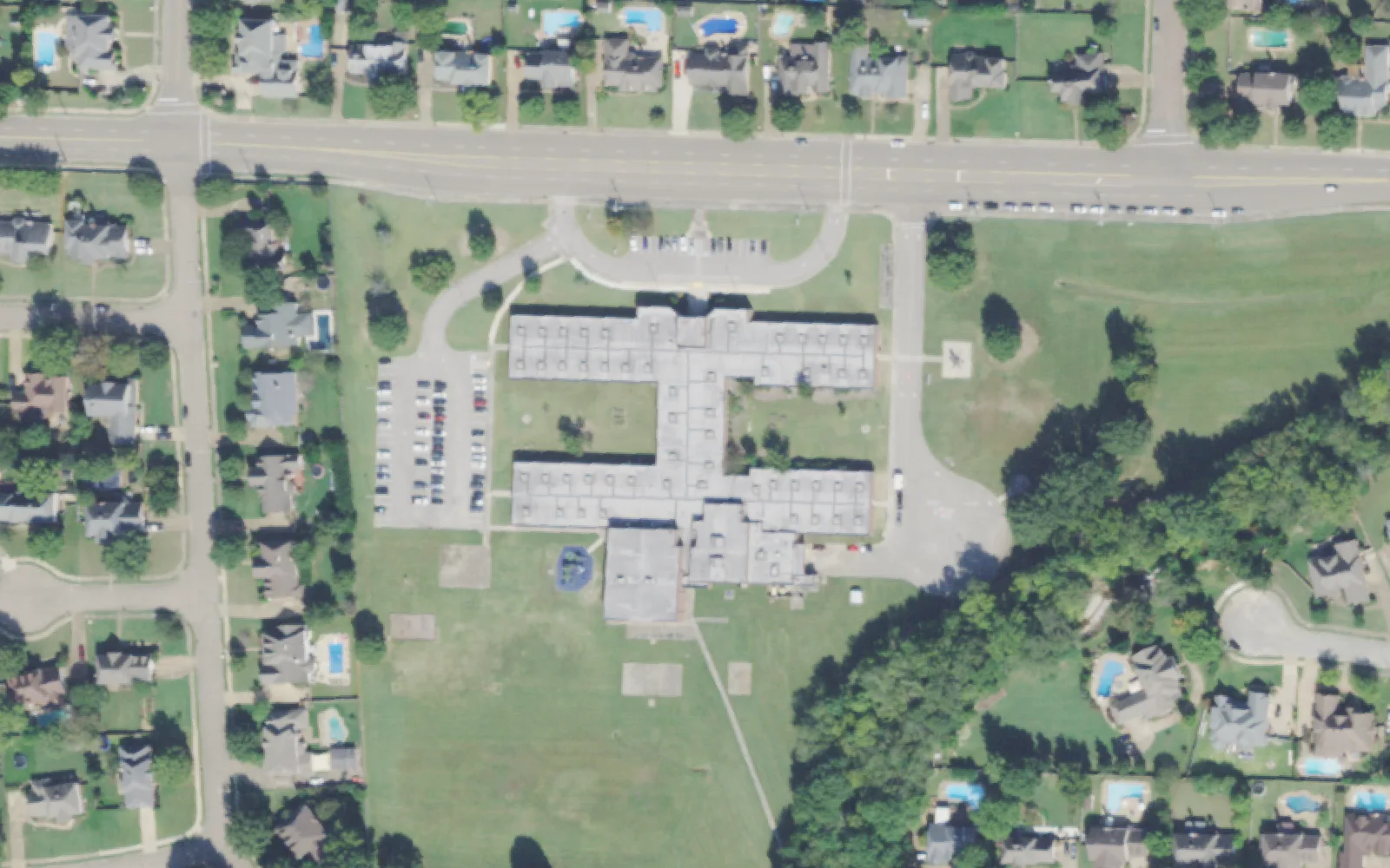 Crosswind Elementary School and its playing field on Shelton Road in Collierville, among streets of homes, seen from the air.