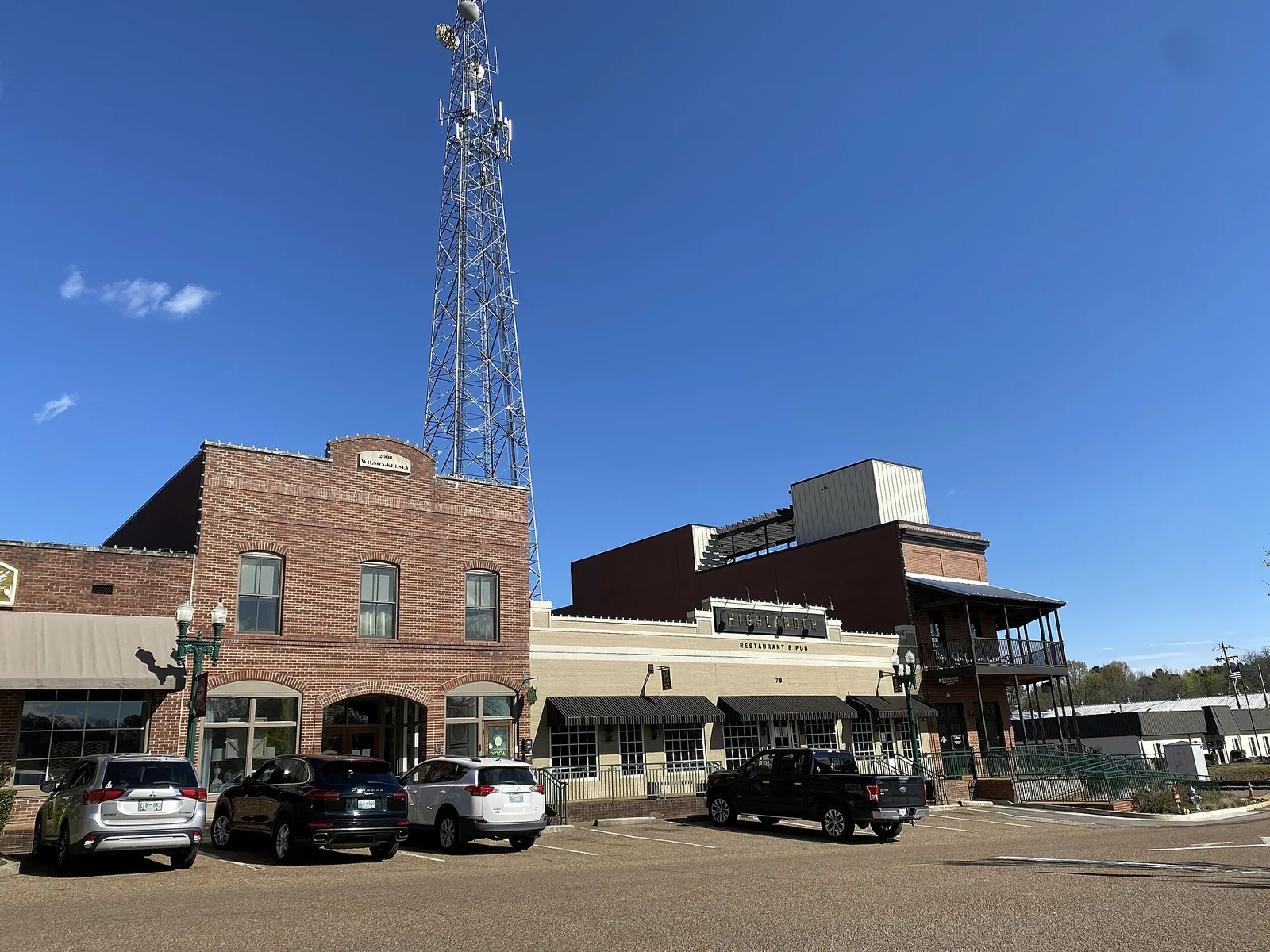 Brick storefronts and lampposts along North Main Street on the Collierville Town Square.