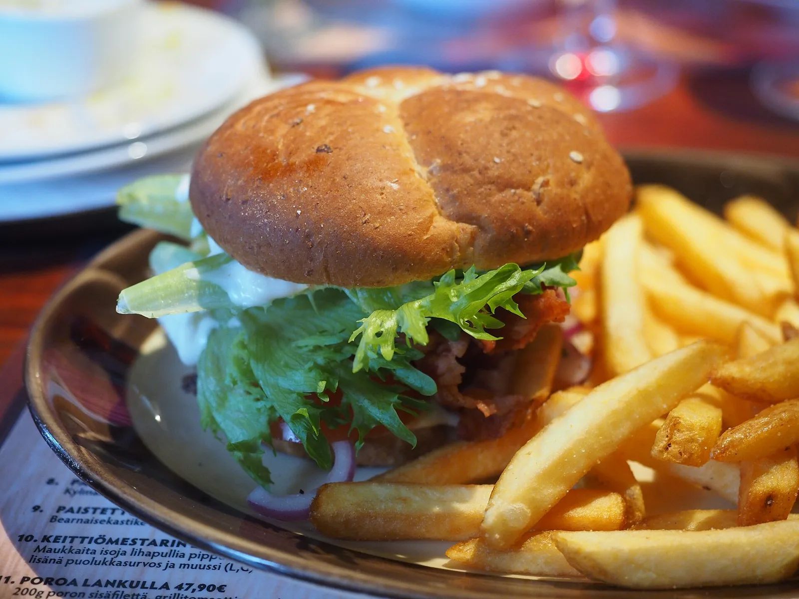 A close-up of a hamburger and French fries served at a restaurant in Kotka, Finland.