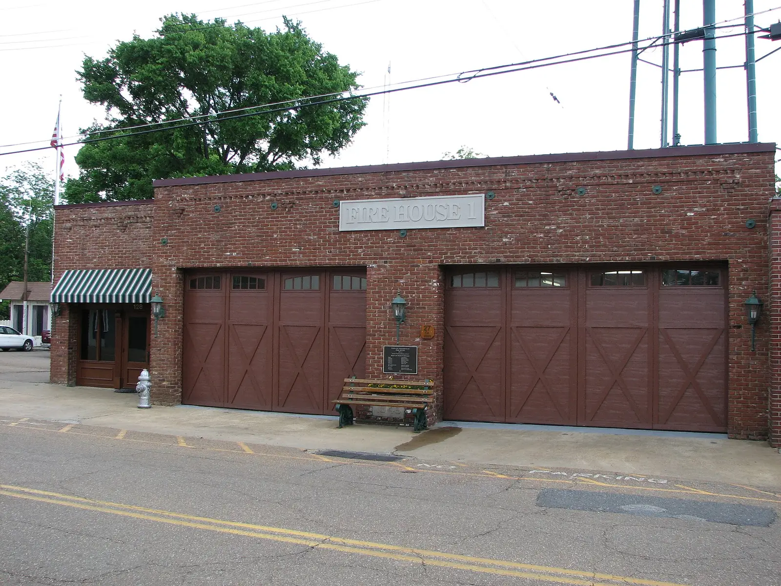 Fire House 1, the brick Collierville Fire Department station near the Town Square, with the town water tower behind it.